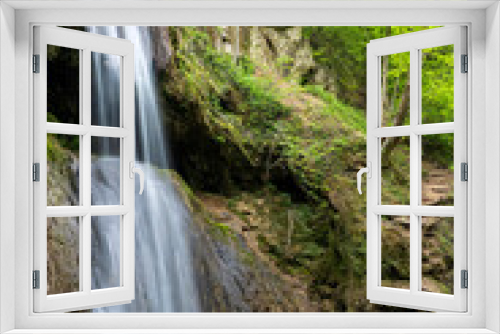 Fototapeta Naklejka Na Ścianę Okno 3D - A spectacular waterfall running wild and free as one of  the most  beautiful sights in nature. Natural phenomenon which takes your breath  away.  Waterfall in Serbia. Mountain river waterfall.  