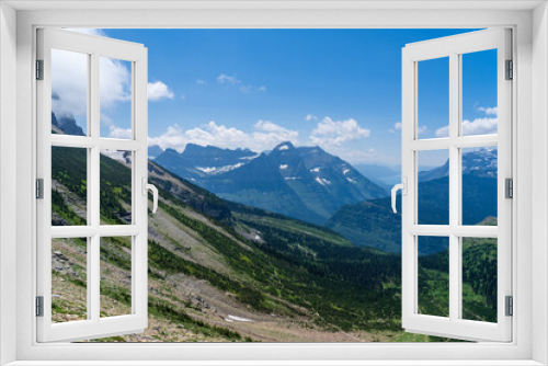 Fototapeta Naklejka Na Ścianę Okno 3D - View of the Garden Wall, Grinnell Glacier Overlook, Lake McDonald, and the Continental Divide while hiking the Highline Trail in Glacier National Park in Montana on a sunny summer day