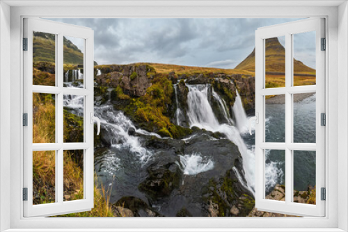 Fototapeta Naklejka Na Ścianę Okno 3D - Famous picturesque Kirkjufell mountain and Kirkjufellsfoss waterfall next to Grundarfjörður at West Iceland autumn view.