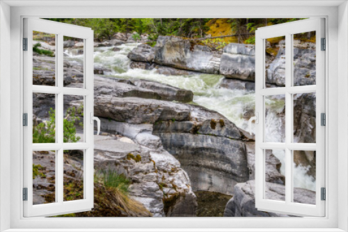 Fototapeta Naklejka Na Ścianę Okno 3D - Turbulent water eroding the rocks of the Maligne Canyon in Jasper National Park, Alberta, Canada