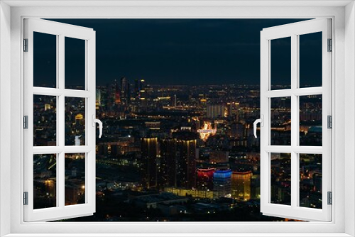 Fototapeta Naklejka Na Ścianę Okno 3D - View of the evening metropolis from a great height