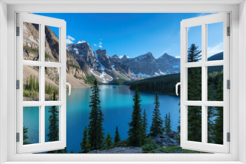 Fototapeta Naklejka Na Ścianę Okno 3D - Beautiful turquoise waters of the Moraine Lake with snow-covered peaks above it in Rocky Mountains, Banff National Park, Canada.	