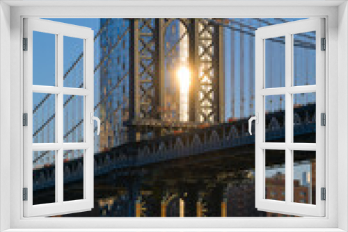 Fototapeta Naklejka Na Ścianę Okno 3D - Travel to New York. The skyline of Manhattan photographed during a summer sunrise, view to Manhattan Bridge. Landmarks of United States of America. Skyscraper office buildings.