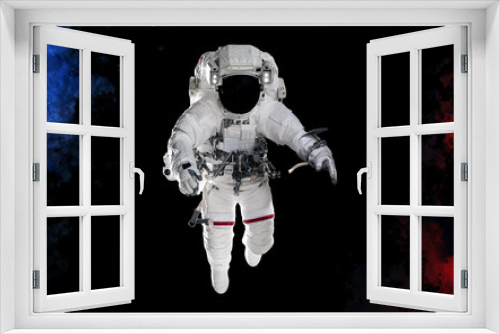 Fototapeta Naklejka Na Ścianę Okno 3D - Astronaut isolated on a black background. Dust splash in space style. Science fiction. Elements of this image furnished by NASA