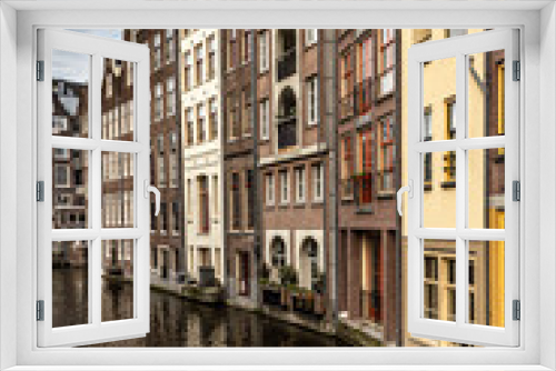 Fototapeta Naklejka Na Ścianę Okno 3D - Street view with buildings and during day and canal in Amsterdam, Netherlands