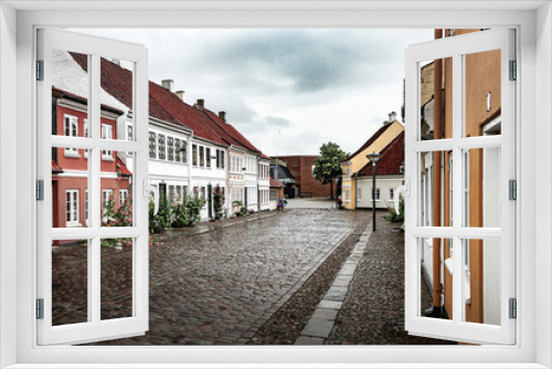 Fototapeta Naklejka Na Ścianę Okno 3D - Charming street corner with beautiful building in Odense, Denmark