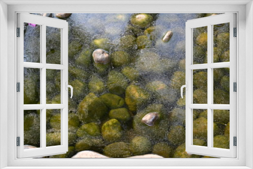 Fototapeta Naklejka Na Ścianę Okno 3D - moss covered stones gleaming in the water