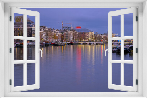 Fototapeta Naklejka Na Ścianę Okno 3D - City scenic from Amsterdam at the river Amstel in the Netherlands at sunset