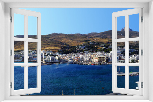 Fototapeta Naklejka Na Ścianę Okno 3D - Superb panoramic view of the port of Tinos, a magnificent Cycladic island in the heart of the Aegean Sea, dominated by the Church of Panaghia Evangelistria
