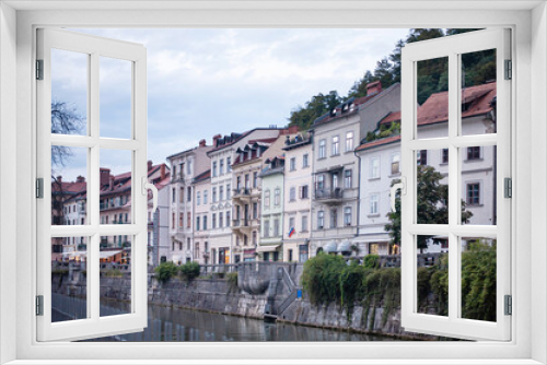 Fototapeta Naklejka Na Ścianę Okno 3D - facade of the street on the banks of Ljubljanica in the center of the old town