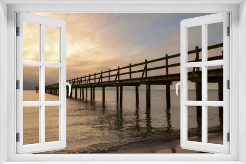 Fototapeta Naklejka Na Ścianę Okno 3D - View at a wooden pier in the sea