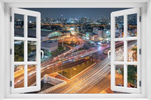 Fototapeta Naklejka Na Ścianę Okno 3D - Bangkok cityscape in Thailand. View of Rama 4 road with cross junction at nigh time.