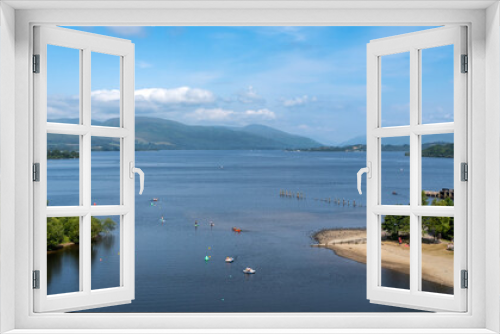 Fototapeta Naklejka Na Ścianę Okno 3D - View over Loch Lomond from Lomond shores on a sunny summer day in Scotland