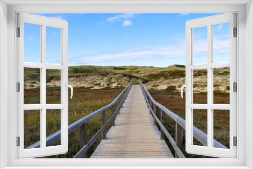 Fototapeta Naklejka Na Ścianę Okno 3D - Wooden walkway through the dunes on Sylt