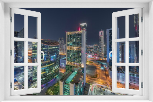 Fototapeta Naklejka Na Ścianę Okno 3D - Dubai international financial center skyscrapers aerial night timelapse.
