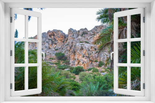 Fototapeta Naklejka Na Ścianę Okno 3D - View of the cliffs among the palm thickets, Preveli, Crete, Greece