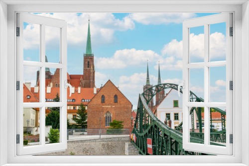 Fototapeta Naklejka Na Ścianę Okno 3D - Wroclaw, Poland - crossed by the Oder River, Wroclaw displays a large number of colorful bridges, which are a main landmark of the town. Here in particular a typical iron bridge