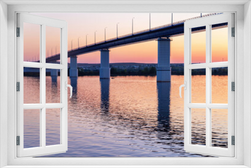 Fototapeta Naklejka Na Ścianę Okno 3D - Automobile bridge over the river at sunset