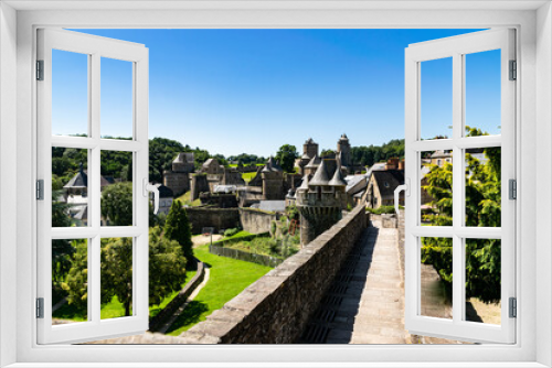 Fototapeta Naklejka Na Ścianę Okno 3D - View from the viewpoint of the medieval fortified Castle of Fougeres.Blue sky on a clear sunny summer day. City of Fougeres, department of Brittany,France.