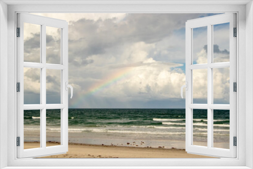 Fototapeta Naklejka Na Ścianę Okno 3D - A Rainbow over the ocean, seen from the beach. 