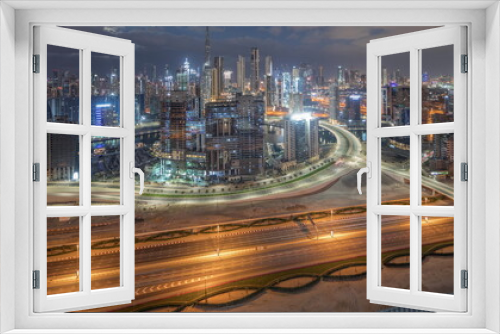 Fototapeta Naklejka Na Ścianę Okno 3D - Panoramic skyline of Dubai with business bay and downtown district night to day timelapse.