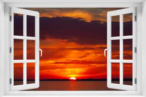 Fototapeta Naklejka Na Ścianę Okno 3D - Majestic red-orange sunset over the sea.