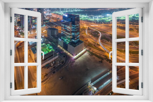 Fototapeta Naklejka Na Ścianę Okno 3D - Aerial view of media city and al barsha heights district area night timelapse from Dubai marina.