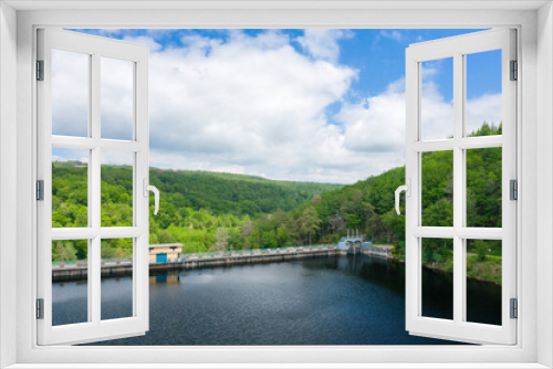 Fototapeta Naklejka Na Ścianę Okno 3D - The Lac de Chaumecon dam surrounded by countryside and forests in Europe, France, Burgundy, Nievre, Morvan, in summer, on a sunny day.