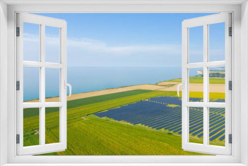 Fototapeta Naklejka Na Ścianę Okno 3D - Norman Solar Panels by the Channel Sea in Europe, France, Normandy, in summer on a sunny day.