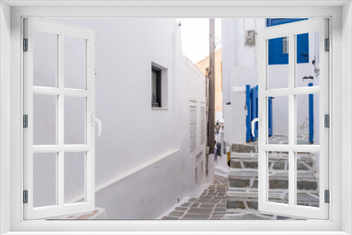 Fototapeta Naklejka Na Ścianę Okno 3D - Cyclades, Greece. Ios, Nios island, Chora. Whitewashed buildings and narrow cobblestone alley.
