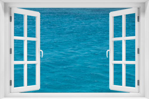 Fototapeta Naklejka Na Ścianę Okno 3D - Sea water background. Ocean surface blue color, small ripples. Summer vacation empty backdrop