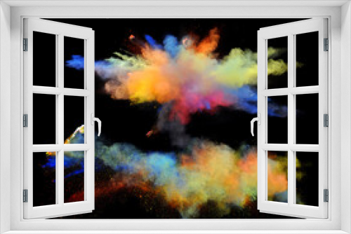 Fototapeta Naklejka Na Ścianę Okno 3D - Rainbow colored powder paint explodes in front of a black background to give off fantastic multi colors and forms.