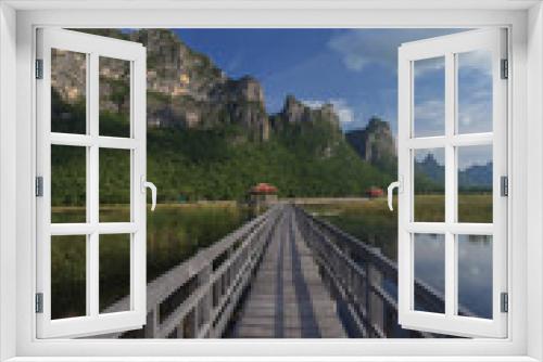 Fototapeta Naklejka Na Ścianę Okno 3D - The wooden walk way in a lake at khao sam roi yod national park,
