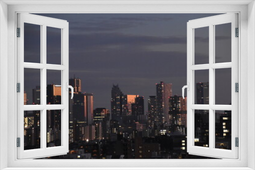 Fototapeta Naklejka Na Ścianę Okno 3D - 夕暮れの新宿のビル群