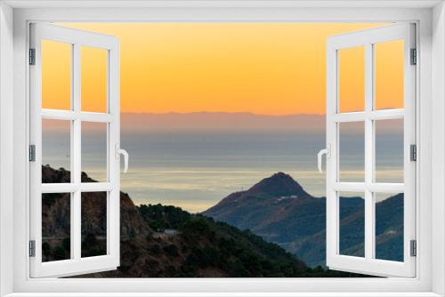 Fototapeta Naklejka Na Ścianę Okno 3D - amanecer a contraluz en la costa del sol visto desde la montaña  Andalucía España	