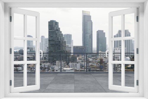 Fototapeta Naklejka Na Ścianę Okno 3D - Panoramic Bangkok skyline view, concrete observatory deck on rooftop, daytime. Luxury Asian corporate and residential lifestyle. Financial city downtown, real estate. Product display mockup empty roof