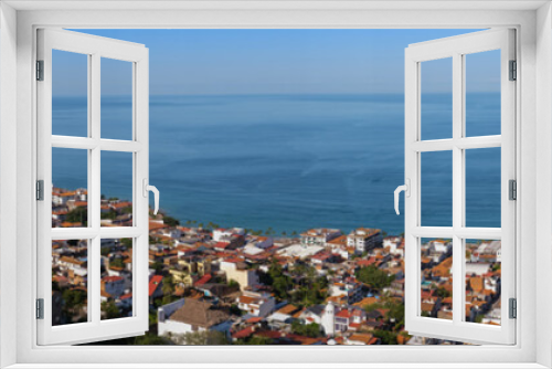 Aerial panoramic view of Puerta Vallarta town and Bay of Banderas, sunny day, blue sky. Travel, vacation, sightseeing concept.