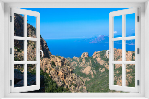 Fototapeta Naklejka Na Ścianę Okno 3D - Aerial view of beautiful view of sunlit red mountains and the Mediterranean Sea with the Bay of Porto in Calanches area near Piana. Corsica island. Tourism and vacaions concept.