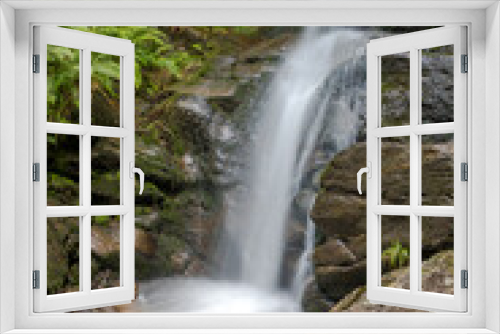 Fototapeta Naklejka Na Ścianę Okno 3D - waterfall and flowing water in a mountain stream