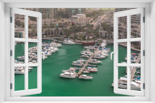 Fototapeta Naklejka Na Ścianę Okno 3D - Luxury boats and yachts docked in Dubai Marina aerial timelapse.