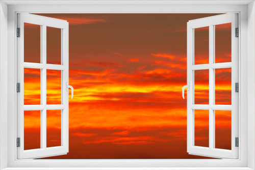 Fototapeta Naklejka Na Ścianę Okno 3D - Photo of the sky with clouds, sunrises, sunsets, orange-yellow tones from the setting sun