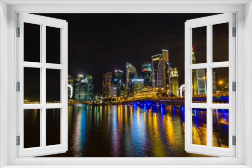 Fototapeta Naklejka Na Ścianę Okno 3D - Singapore skyline at night with urban buildings