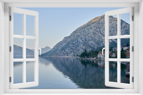 Fototapeta Naklejka Na Ścianę Okno 3D - Morning seascape by the sea with mountains and a city in Montenegro