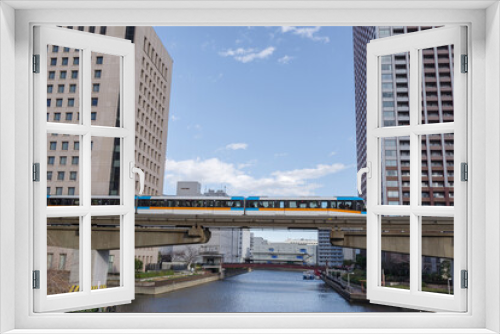 Fototapeta Naklejka Na Ścianę Okno 3D - なぎさ通りの渚橋の上をモノレールが交差していく　港区、海岸・芝浦地区の風景