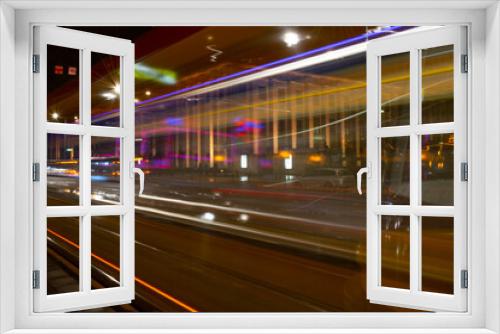 Tram Lights in the Busy Streets of a Big City at Night