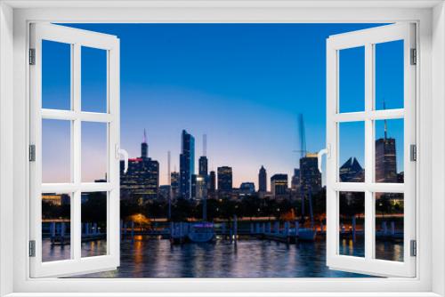 Fototapeta Naklejka Na Ścianę Okno 3D - A picturesque view of Downtown skyscrapers of Chicago skyline panorama over Lake Michigan at night time, Chicago, Illinois, USA