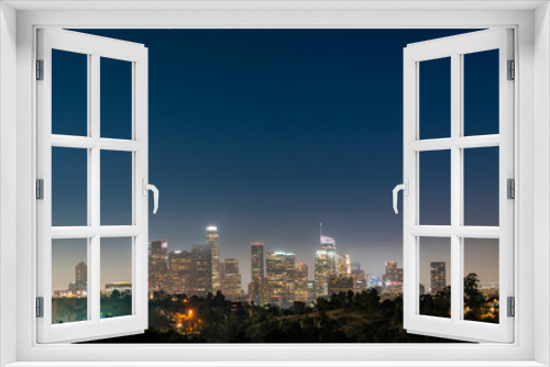 Fototapeta Naklejka Na Ścianę Okno 3D - Illuminated Skyline of Los Angeles downtown at summer night time, California, USA. Skyscrapers of panoramic city center of LA.