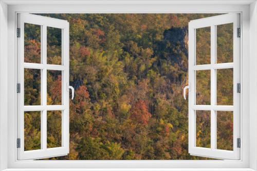 Fototapeta Naklejka Na Ścianę Okno 3D - Colorful autumn forest landscape with limestone rock outcrop in scenic mountain valley, Chiang Dao, Chiang Mai, Thailand