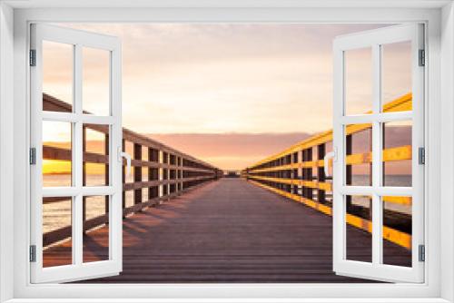 Fototapeta Naklejka Na Ścianę Okno 3D - Sunset at the beach bridge
