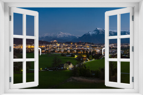 Fototapeta Naklejka Na Ścianę Okno 3D - Panorama view of the famous city of Salzburg in the evening at the blue hour, in the background the snow-covered Berchtesgaden Alps, Austria, Europe